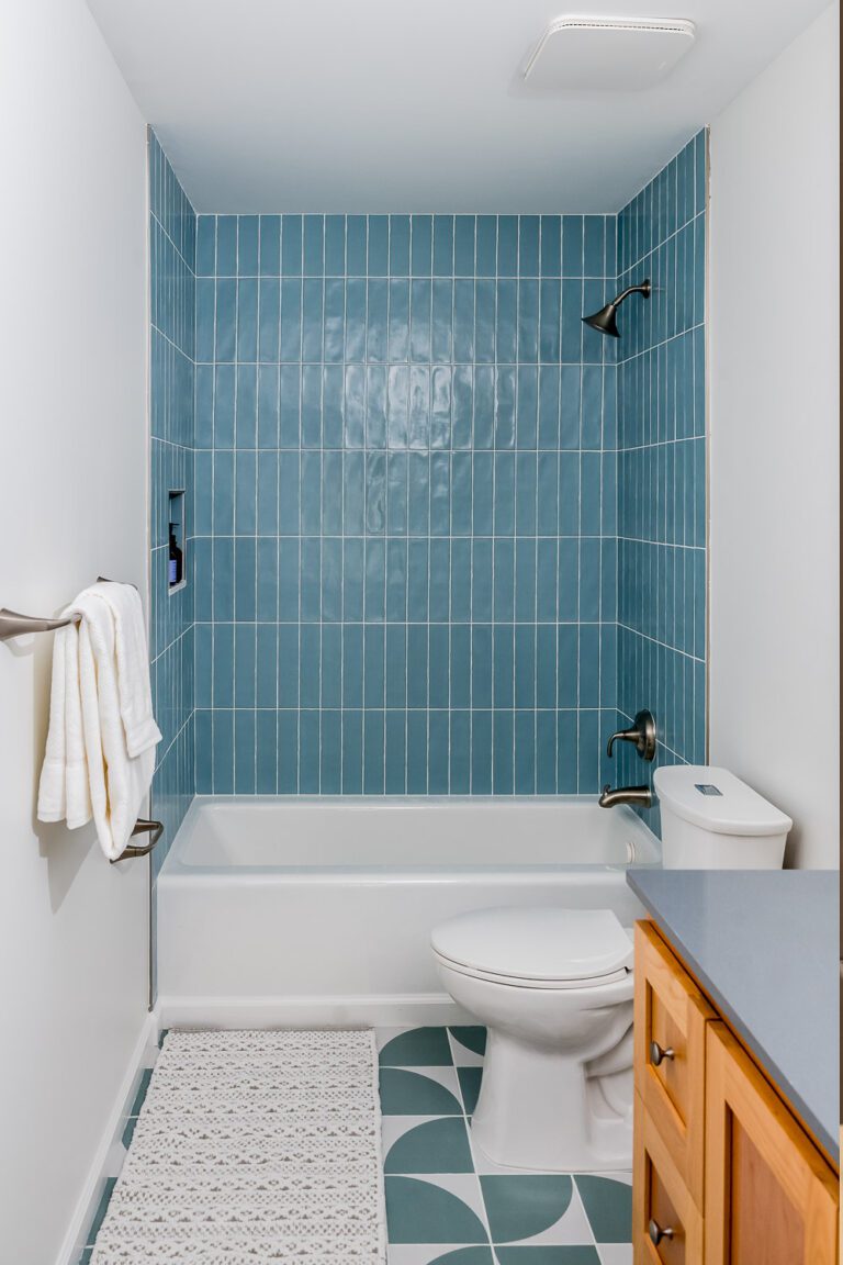 Cary Bathroom Remodeling Tub with Blue Vertical Tile Surround